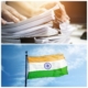 A picture of a stack of documents on top of an image of the flag of India